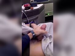BOY ON THE PLANE GETTING A HANDJOB