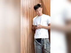 Handsome Asian jerks and cums in fitting room
