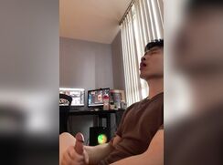 cute asian boy jerks off and moans in his bed