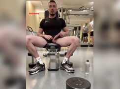 Playing With His Uncut Cock In Gym