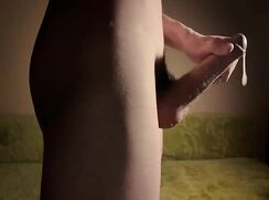 Twink's big cock spills its load.