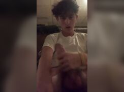 Curly headed boy enjoys his slippery cock