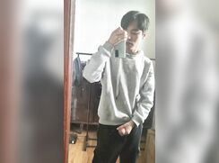 chinese boy in hoodie masturbates in front of mirror (no cum)