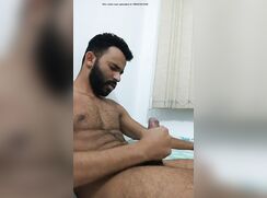 Hairy brazilian jerks off and cums