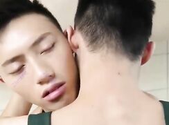 two Asian make love in the kitchen