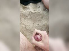Horny twink jerks his big uncut cock on the beach - 11-15-25