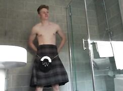 A boy removes his kilt
