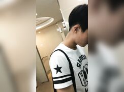 chinese college guy peeing at urinal