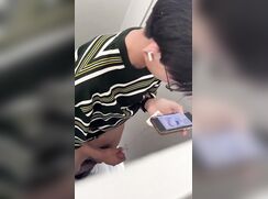 nerdy chinese boy cumming on the stall door