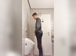HUGE young man at the Urinal (god I wish i walked in on him)