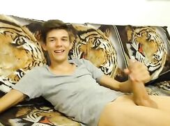 Hung wanker on tiger couch