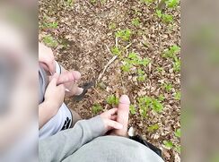 two boys pissing in the park