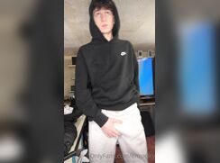 In a tracksuit a boy jerks off