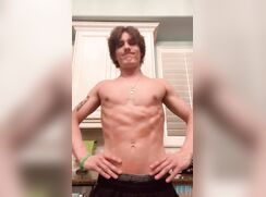 Tattooed muscle boy flexing (no nudity)