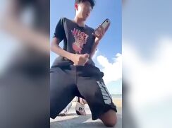 Twink jerks-off and cums outside