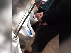 Spying: Is he pee or jerking?