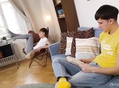 two pretty twinks on a sofa