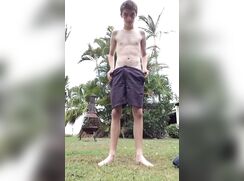 Outdoor stripping skinny boy