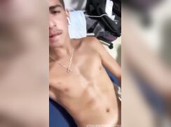 A horny guy strokes his cock and moans