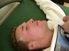 Boy on green table gets a facial