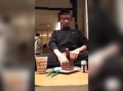 Guy jerks-off in a busy fast food restaurant