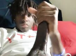 Cute black teen playing with his monster dick