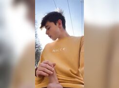 Pretty twink jerks outside