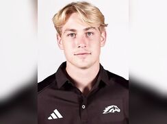 straight blonde boy hockey player in locker room