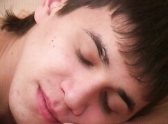 An older guy and a Russian student are playing in bed.