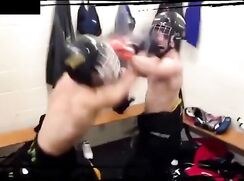 Two boys fighting in locker-room