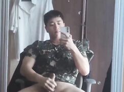 cute korean military guy jerks off in front of the mirror