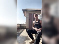 Horny teen jerks-off on the roof terrace