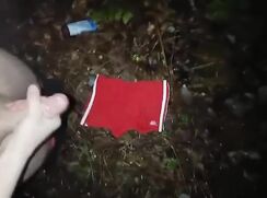 Young guy cums outdoors on his swimming trunks