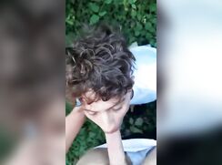 Twink sucks his friend's cock and balls outdoors