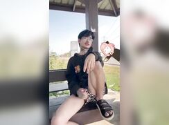 Asian twink jerks near a busy roadway