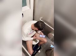 Uncut guy stroking in bathroom
