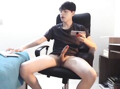 Horny boy wanking and cumming on cam