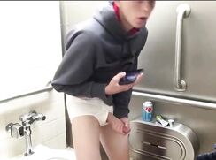 Hung Twink in white briefs jerks-off in public toilet