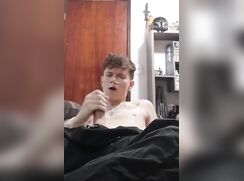 Tattooed boy in black pants cumshot
