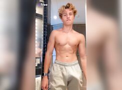 Messy haired blonde lad shows off