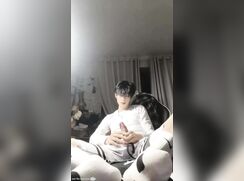 Asian twink jerks off and gives himself a footjob