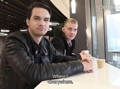 CH 315, Camera guy pays 2 young guys drinking coffee in a black jacket and a black "A