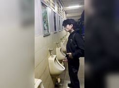 Asian pissing in a urinal