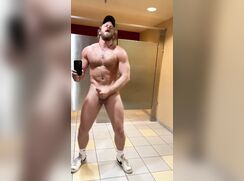 Blond muscle jerking off in public