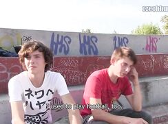 CH 375, Camera guy pays 2 young guys, one in a white Japanese T, the other in a red "