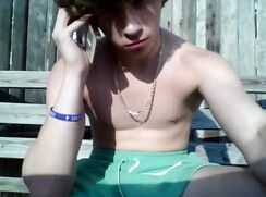 Twink with nice hair gets interrupted while jerking off outside, but finishes the job