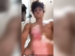 Curly-haired boy wanks in the bathroom