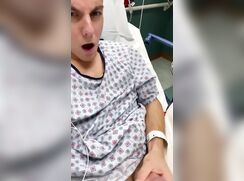 Guy jerks-off in a hospital bed