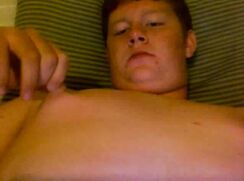 Chubby ginger plays with his nipples and masturbates