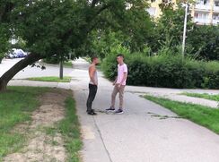 CH 475, Camera guy pays 2 young guys, one in grey singlet, the other in a pink T in